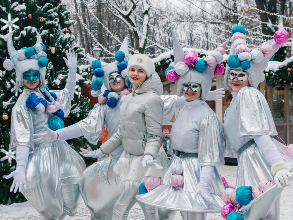 five ladies in a grey festive bubble suit in winter during christmas season